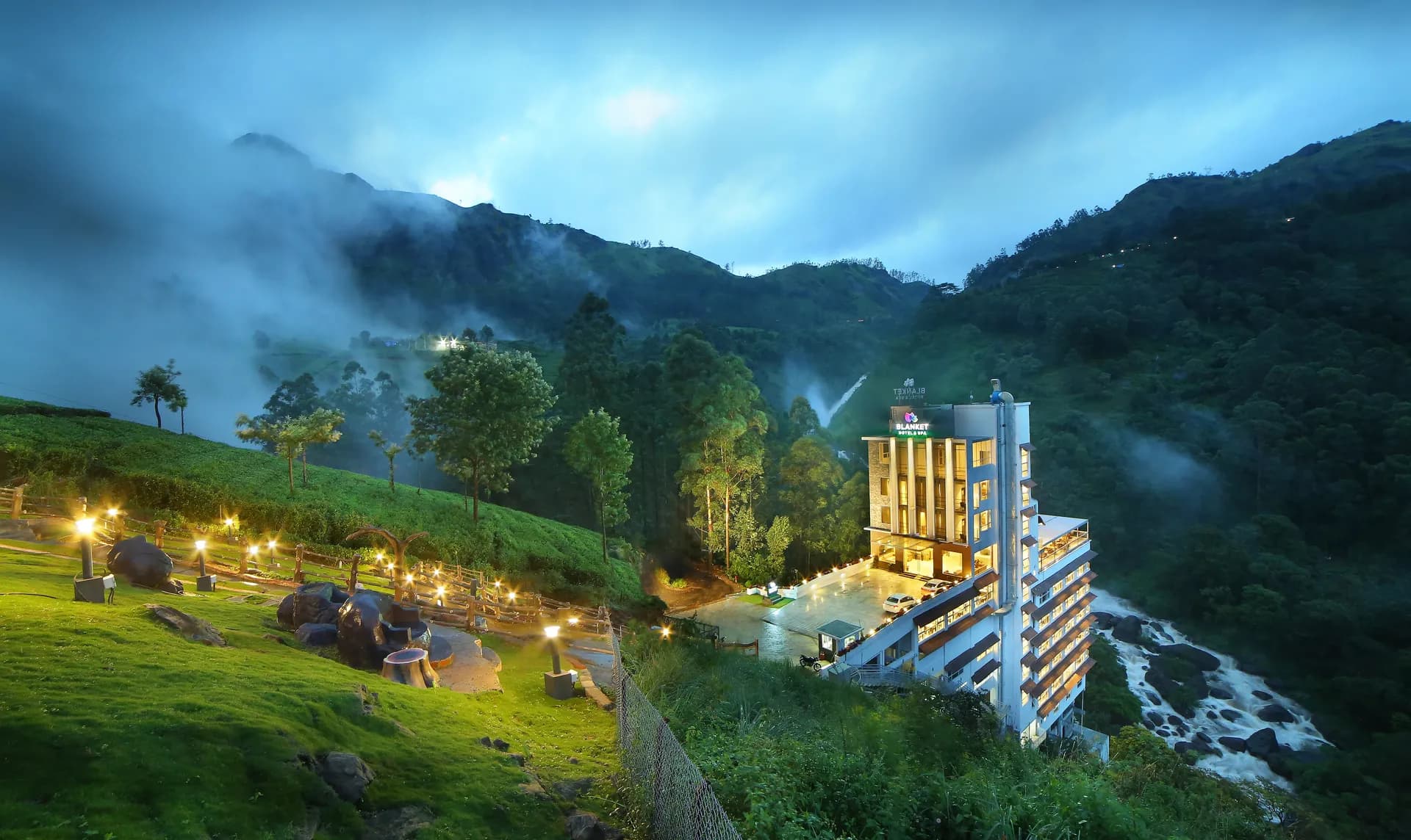 The landscape of Munnar — mist, tea hills, waterfalls